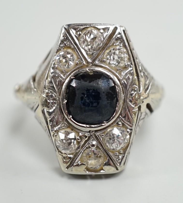 A 1940's? white metal, sapphire and diamond cluster set hexagonal dress ring, size L, gross weight 4.6 grams.